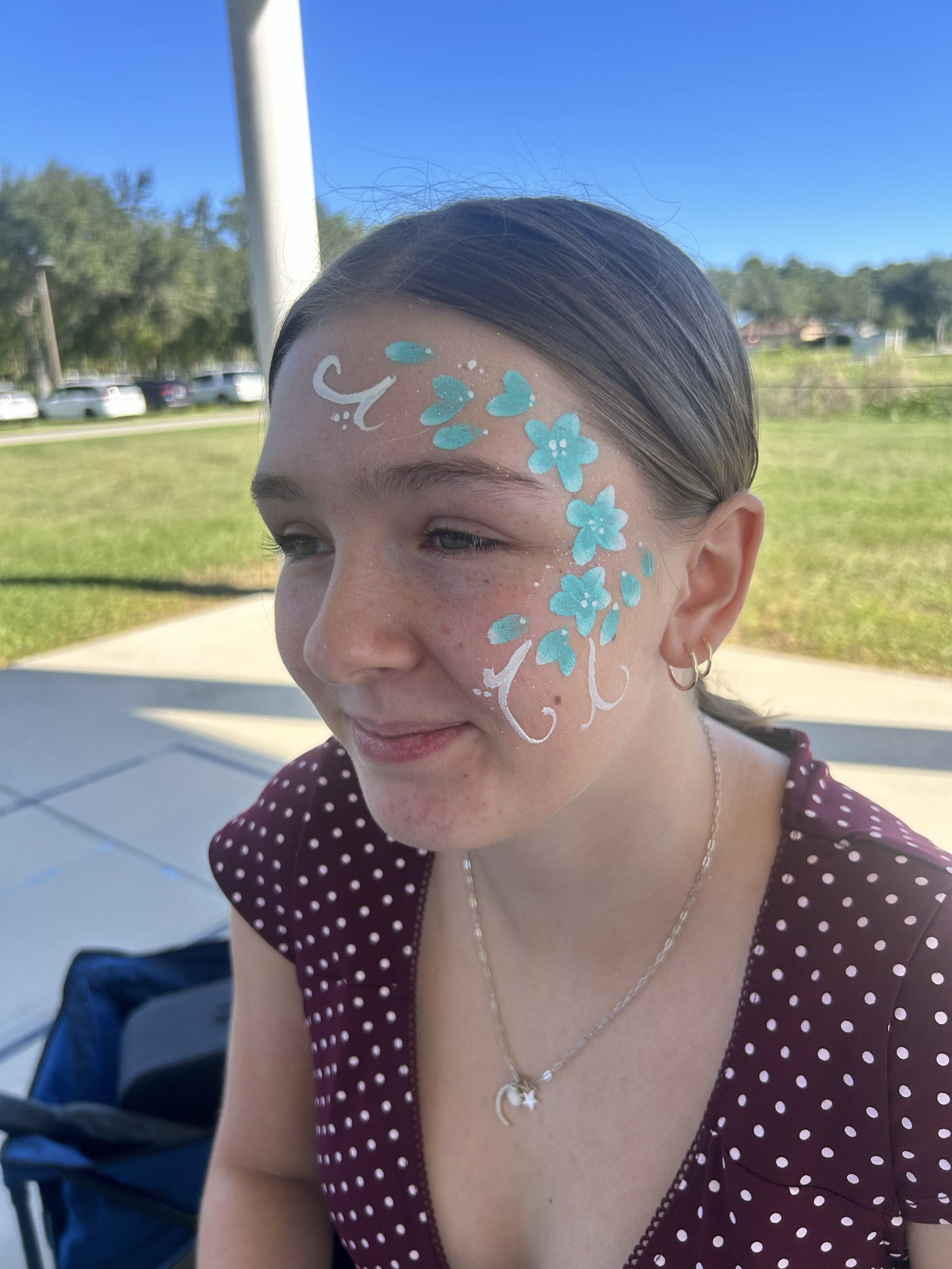 teal flowers facepaint